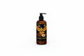Load image into Gallery viewer, Beard care product bottle with 'Black Label Beard Care' label on a black background