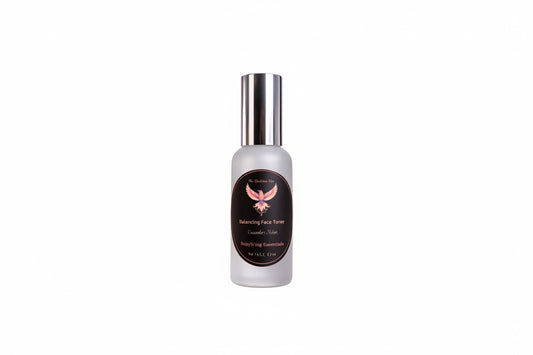 Bottle of Balancing Face Toner with a silver cap on a light purple background